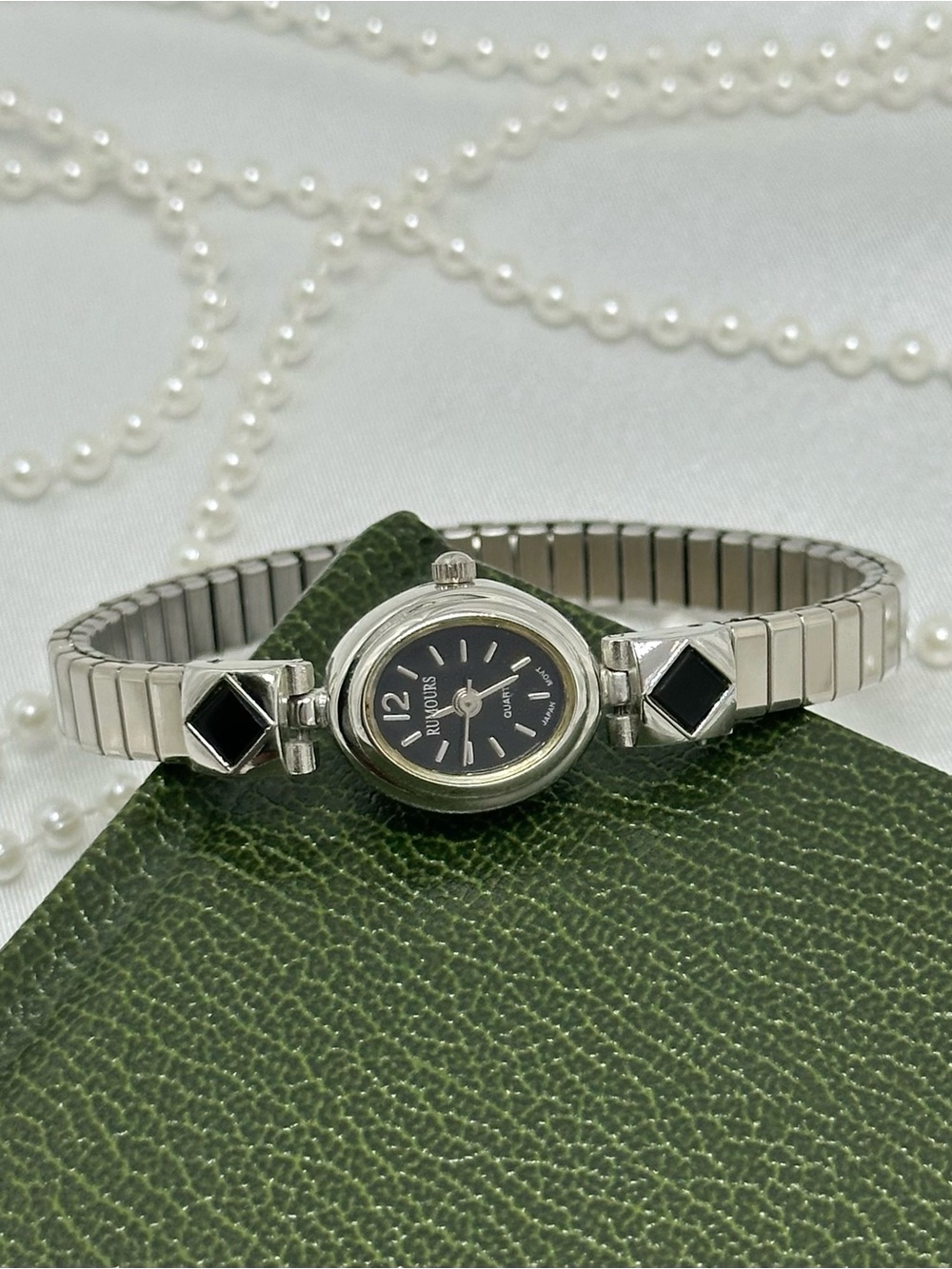 Dainty Silver and Black Oval Dial Rumours Watch